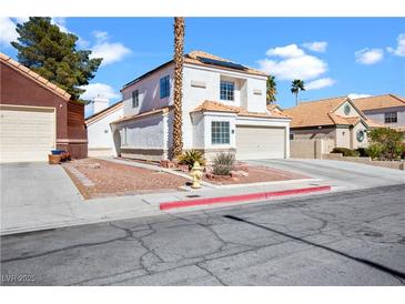 Charming two-story home with well-maintained landscaping and a cozy, inviting curb appeal on a sunny day at 2108 Running River Rd, Henderson, NV 89074