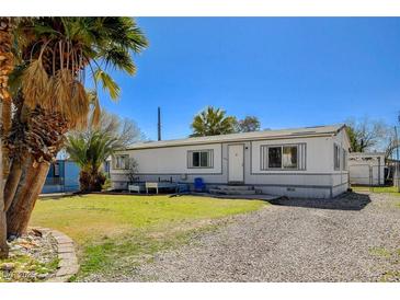 Charming single story home with a well-manicured lawn and gravel landscaping at 425 Bonelli Ave, Overton, NV 89040