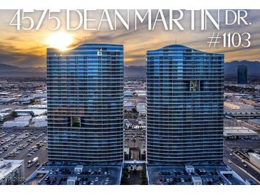 Stunning aerial view of luxury high-rise condos with city skyline and vibrant sunset in the background at 4575 Dean Martin Dr # 1103, Las Vegas, NV 89103