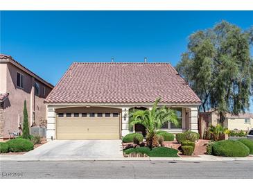 Charming single-story home featuring a two-car garage, landscaped yard, and a tile roof at 5350 Tulip Hill Ave, Las Vegas, NV 89141