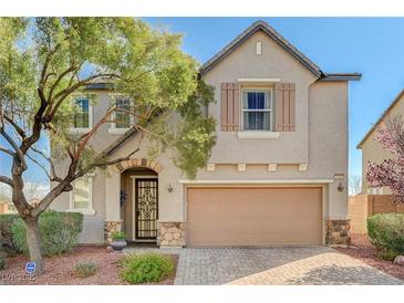 Charming two-story home features a neutral palette, well-manicured landscaping, and a two-car garage at 7018 Hunts Corner St, Las Vegas, NV 89166