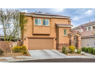 Two-story home with a two-car garage, stone accents and well-maintained landscaping at 7948 Eastern Elk St, Las Vegas, NV 89149