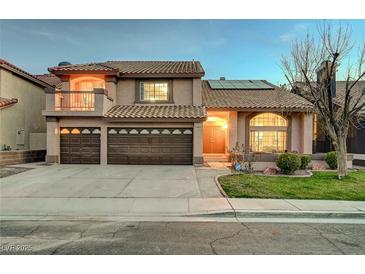 Charming two-story home with desert landscaping, three-car garage, second story balcony, and a tiled roof at 2813 Via Avanti St, Henderson, NV 89074