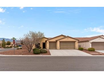 Charming single-story home with a three-car garage and desert landscaping at 4755 Rossini St, Pahrump, NV 89061