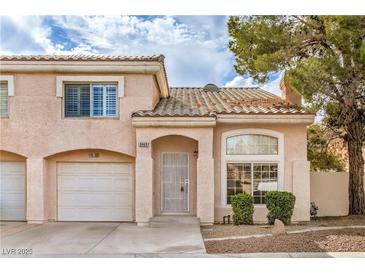 Charming two-story home with tile roof, desert landscaping, and attached one car garage at 8469 Sewards Bluff Ave, Las Vegas, NV 89129