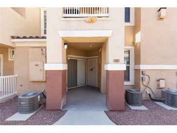 Inviting townhome entrance with covered walkway and neutral color scheme at 5855 Valley Dr # 1107, North Las Vegas, NV 89031