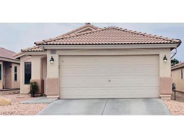 Charming single-story home featuring a well-maintained front yard and attached two-car garage at 6445 Glory Rise Ct, Las Vegas, NV 89142