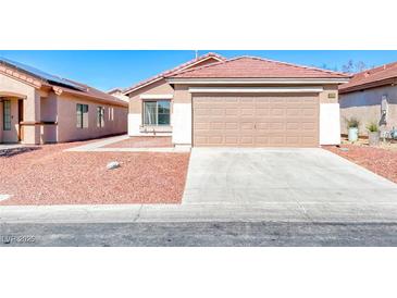 Charming single-story home with a two-car garage and desert landscaping at 6552 Coldwater Bay Dr, Las Vegas, NV 89122