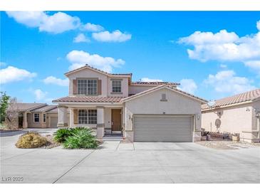 Charming two-story home featuring a spacious driveway and well-maintained front yard landscaping at 6817 Frances Celia Ave, Las Vegas, NV 89122