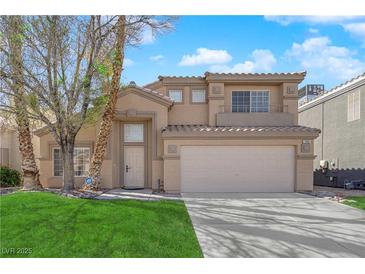 Charming two-story home with a well-maintained lawn and desert landscaping in a residential neighborhood at 7213 Buglehorn St, Las Vegas, NV 89131