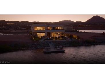 Beautiful modern waterfront home featuring a private dock with seating area for relaxing at 1572 Pleasant Bay Ct, Henderson, NV 89011