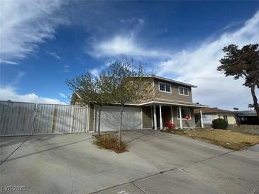Two story home with a large driveway and two car garage at 4262 Tarkin Ave, Las Vegas, NV 89120
