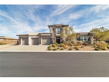 Modern two-story home featuring a three-car garage and professionally landscaped front yard at 6130 Pebble Glen, Las Vegas, NV 89149