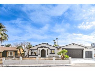 Charming single-story home showcasing desert landscaping and a classic architectural style at 6597 Mountainwood Ln, Las Vegas, NV 89103