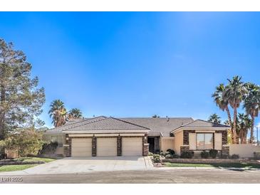 Charming single-story home featuring a 3-car garage and desert landscaping at 6741 Philippe Allen Ave, Las Vegas, NV 89110