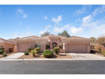 Charming single-story home featuring a well-manicured front yard and a spacious three-car garage at 10129 Elk Valley St, Las Vegas, NV 89178