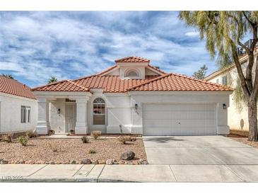 Charming single-story home featuring a red tile roof, two-car garage, and low-maintenance landscaping at 239 Highgate St, Henderson, NV 89074