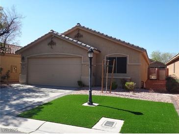 Charming single-story home with well-maintained lawn and desert landscaping on a sunny day at 3507 Pointe Vedra Ct, Las Vegas, NV 89122