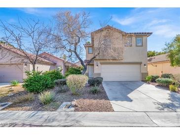 Inviting two-story home with a well-maintained lawn, mature landscaping, and a spacious two-car garage at 3703 Laguna Veneta Ave, Las Vegas, NV 89141