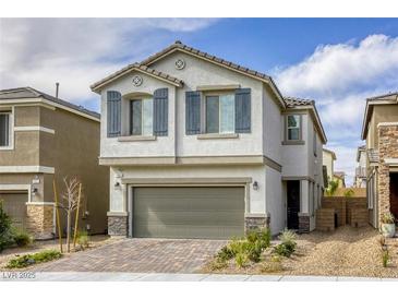 Charming two-story home featuring a neutral stucco facade, decorative shutters, and an attached two-car garage at 7061 Tilligerry St, North Las Vegas, NV 89084