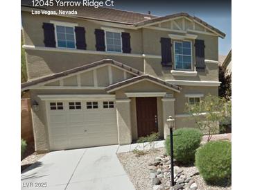 Charming two-story home with a two-car garage and well-maintained landscaping at 12045 Yarrow Ridge Ct, Las Vegas, NV 89183