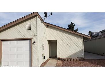 Front exterior view of single Gathering home with garage, showing facade details and front walkway at 2021 San Simeon St, Las Vegas, NV 89108
