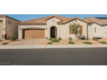 Charming single-story home showcasing a well-maintained lawn, a two car garage and tile roof at 6225 Gambetta St, Las Vegas, NV 89115