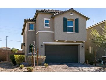 Charming two-story home with a well-maintained front yard and a two-car garage at 6308 Gulf Waters St, North Las Vegas, NV 89081