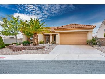 Charming single-story home featuring desert landscaping, a spacious driveway, and a two-car garage at 10401 Sea Palms Ave, Las Vegas, NV 89134