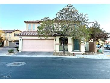 Charming two-story home with a two-car garage and desert landscaping at 6087 Devers Ct, Las Vegas, NV 89118