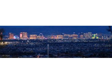 Nighttime view of the bright Las Vegas city skyline from a distance at 6828 Sumatra St, Las Vegas, NV 89166