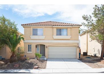 Charming two-story home with a well-maintained lawn and a two-car garage at 5615 Believe Ct, Las Vegas, NV 89139