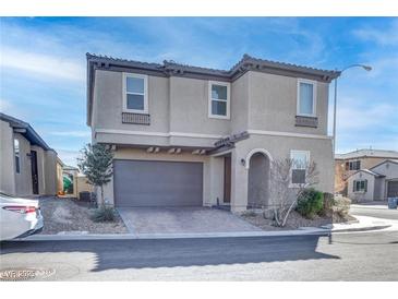 Charming home featuring a 2-car garage and neutral stucco exterior, located in a well-maintained community at 6833 Wispy Sky Ct, Las Vegas, NV 89142