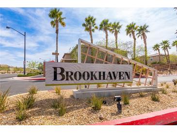 Brookhaven community entrance sign with palm trees and desert landscaping in a sunny neighborhood at 9445 Sweetwood Ave, Las Vegas, NV 89149
