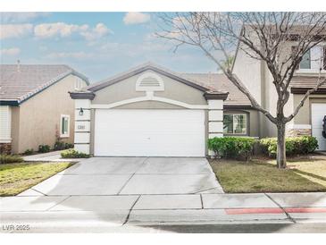 Charming single-Gathering home featuring a two-car garage, desert landscaping, and neutral color palette at 10341 Birch Bluff Ln, Las Vegas, NV 89145
