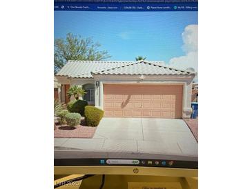 Charming single-story home featuring desert landscaping and a two-car garage at 8328 Carmen Blvd, Las Vegas, NV 89128