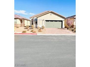 Charming single-story home with a two-car garage and low-maintenance landscaping at 8628 Vondel Park St, Las Vegas, NV 89148