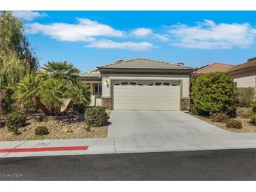 Charming single-story home features a well-maintained yard and an attached two-car garage at 2580 Flare Star Dr, Henderson, NV 89044