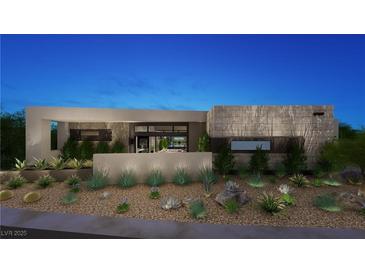 Modern home with unique landscaping featuring desert plants and decorative rock at 2630 Juniper Branch St, Las Vegas, NV 89117