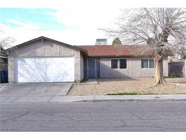 Traditional single-story home featuring low maintenance front yard and a two-car garage at 4120 E Cincinnati Ave, Las Vegas, NV 89104