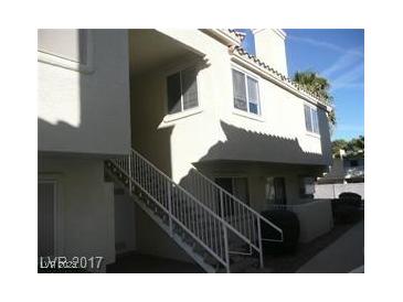 A bright exterior view of a two-story home with white siding and white trim at 833 Aspen Peak Loop # 2614, Henderson, NV 89011