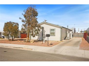 Charming single-story home with a well-maintained yard and long concrete driveway at 274 Aztec Ln, Henderson, NV 89015