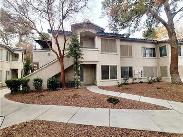 Inviting condo with well-maintained landscaping, featuring a private entrance and neutral toned stucco at 3083 Casey Dr # 101, Las Vegas, NV 89120