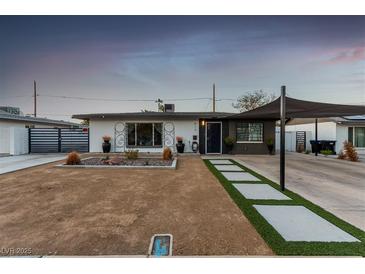Charming single-story home featuring modern landscaping and a covered carport at 813 Bonita Ave, Las Vegas, NV 89104
