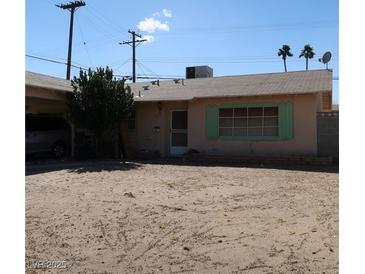 Charming single-story home with a classic design and desert landscaping in the front yard at 3091 Oxford Ln, Las Vegas, NV 89121