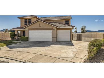 Spacious two-story home with a three-car garage and well-maintained landscaping at 525 Sunnys Halo Ct, Henderson, NV 89015
