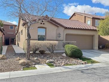 Charming single story home featuring desert landscaping and a two car garage at 7317 Caballo Range Ave, Las Vegas, NV 89179