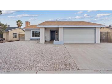 Charming single-story home featuring a two car garage and low maintenance desert landscaping at 7181 Pleasant View Ave, Las Vegas, NV 89147