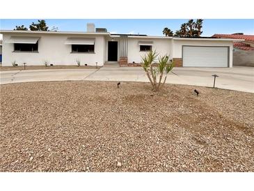 Charming single-story home with low-maintenance landscaping and a circular driveway at 810 Kenny Way, Las Vegas, NV 89107
