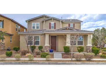 Charming two-story home with a well-maintained yard and inviting front porch at 3237 Mist Effect Ave, Henderson, NV 89044